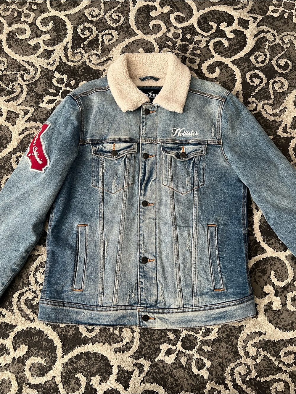 Hollister Co. blue denim jacket with white fur collar and red California logo